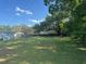 Lush, green, expansive yard with mature trees, offering privacy and potential for outdoor activities at 37906 Tucker Rd, Zephyrhills, FL 33542