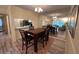 Open-concept dining area with a modern dining set, ideal for gatherings and everyday meals at 3232 Lake Pine E Way # G1, Tarpon Springs, FL 34688