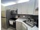 Well-equipped kitchen boasting stainless steel appliances and modern finishes at 3232 Lake Pine E Way # G1, Tarpon Springs, FL 34688