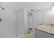 Bathroom features a walk-in shower with white tile, granite vanity and a bright, neutral color palette at 3301 Bayshore Blvd # 503, Tampa, FL 33629