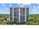 Striking high-rise condo building with meticulously maintained landscaping and gorgeous trees surrounding property at 3301 Bayshore Blvd # 503, Tampa, FL 33629