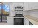 Kitchen with stainless appliances, granite countertops, subway tile backsplash, and a large window at 3301 Bayshore Blvd # 503, Tampa, FL 33629