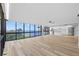 Expansive living room with views of the water, showcasing a modern kitchen and luxury vinyl floors at 3301 Bayshore Blvd # 503, Tampa, FL 33629