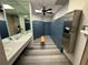 Well-maintained locker room with sleek blue lockers, ample counter space, and a large mirror for convenience at 3301 Bayshore Blvd # 503, Tampa, FL 33629