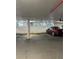 Secured parking garage featuring a sleek red car and assigned parking spots near natural lighting at 3301 Bayshore Blvd # 503, Tampa, FL 33629