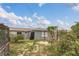 Backyard featuring a gazebo and tropical landscaping, creating a tranquil outdoor retreat at 3432 Monticello St, Holiday, FL 34690