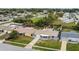 Cozy single-story home featuring a well-maintained lawn, front porch, and attached garage in a tranquil neighborhood setting at 3432 Monticello St, Holiday, FL 34690