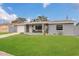 Charming single-story home featuring a well-manicured lawn and a welcoming front porch at 3432 Monticello St, Holiday, FL 34690