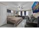 Spacious living room with multiple TVs, ceiling fan, natural light, and tiled floors at 3432 Monticello St, Holiday, FL 34690