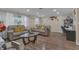 Spacious living room with hardwood floors, comfortable seating, and ample natural light at 3432 Monticello St, Holiday, FL 34690