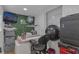 Bright room featuring a decorative wall, workspace, and natural light for a creative or professional setting at 3432 Monticello St, Holiday, FL 34690