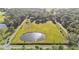 Sprawling land with a private pond, surrounded by trees and accessible roads at 4142 El Shaddiai Sq, Plant City, FL 33565