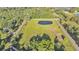 Aerial view of vacant rectangular property with well maintained lawn and pond at 4142 El Shaddiai Sq, Plant City, FL 33565