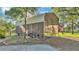 Spacious carport area providing ample covered storage with an American flag waving nearby at 4142 El Shaddiai Sq, Plant City, FL 33565