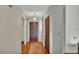 Cozy entryway featuring wood floors, neutral walls, and a wood-look closet at 4142 El Shaddiai Sq, Plant City, FL 33565