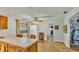 Kitchen features long countertops, wood cabinets and modern lighting at 4142 El Shaddiai Sq, Plant City, FL 33565