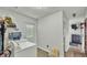 Bright laundry room with washer, dryer, and convenient storage at 4142 El Shaddiai Sq, Plant City, FL 33565
