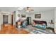 Open-concept living room with wood flooring, safe, and neutral tones at 4142 El Shaddiai Sq, Plant City, FL 33565