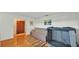 This living room is decorated with neutral paint and wood flooring with a view to the front entry at 4142 El Shaddiai Sq, Plant City, FL 33565