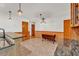 An eat-in dining area features tile flooring and a view into the updated kitchen at 4910 Thonotosassa Rd, Plant City, FL 33565