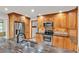 Updated kitchen with granite countertops, stainless steel appliances, and custom wood cabinetry at 4910 Thonotosassa Rd, Plant City, FL 33565