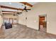 Spacious living room features high ceilings, wood beams, and tile floors at 4910 Thonotosassa Rd, Plant City, FL 33565