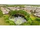 Aerial view of the pond and surrounding community offering a serene natural landscape at 2125 Wild Grape Pl, Riverview, FL 33578