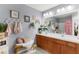 Stylish bathroom features double sinks, vanity, and decorative elements at 2125 Wild Grape Pl, Riverview, FL 33578