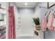 Bright bathroom featuring a tub-shower combo with decorative pink shower curtain at 2125 Wild Grape Pl, Riverview, FL 33578