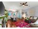 Open living area with decorative rug, stylish furniture, and a view into the dining area at 2125 Wild Grape Pl, Riverview, FL 33578