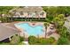 An overhead shot of the community swimming pool area, with lush tropical landscaping at 2125 Wild Grape Pl, Riverview, FL 33578