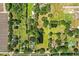 A bird's eye view showcases a vast landscape including property lines, ponds, and lush foliage at 4101 N Forbes Rd, Plant City, FL 33565
