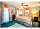 Relaxing bedroom with floral wallpaper, complementing curtains and a comfortable bed at 4101 N Forbes Rd, Plant City, FL 33565