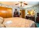 The bedroom is decorated with floral wallpaper, wood dressers, and a large bed at 4101 N Forbes Rd, Plant City, FL 33565