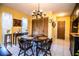 Cozy dining area featuring a classic chandelier and ample natural light at 4101 N Forbes Rd, Plant City, FL 33565