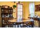 Charming dining room showcases a wooden table and a quaint built-in display cabinet at 4101 N Forbes Rd, Plant City, FL 33565