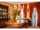 Traditional dining room featuring vintage chandelier, beautiful wall coverings, and spacious design for entertaining at 4101 N Forbes Rd, Plant City, FL 33565
