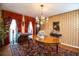 Traditional dining room with vintage chandelier, and beautiful decor at 4101 N Forbes Rd, Plant City, FL 33565