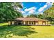 Inviting one-story home with manicured lawn and landscaping, set under a bright sky at 4101 N Forbes Rd, Plant City, FL 33565