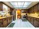 Bright kitchen boasts stainless steel appliances and a view into the dining area at 4101 N Forbes Rd, Plant City, FL 33565