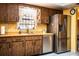 Well-equipped kitchen features stainless steel appliances and classic wood cabinetry at 4101 N Forbes Rd, Plant City, FL 33565