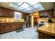 Spacious kitchen with a skylight, stainless steel appliances, and ample cabinet space at 4101 N Forbes Rd, Plant City, FL 33565
