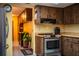 Well-maintained kitchen with wood cabinetry, stainless steel appliances, and light yellow tile backsplash at 4101 N Forbes Rd, Plant City, FL 33565