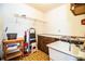 Functional laundry room with utility sink, built-in cabinets, and storage space at 4101 N Forbes Rd, Plant City, FL 33565