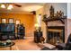 Inviting living room featuring a brick fireplace, media center, and comfortable seating at 4101 N Forbes Rd, Plant City, FL 33565