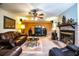 Inviting living room with a brick fireplace, and comfortable leather furniture at 4101 N Forbes Rd, Plant City, FL 33565
