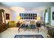 An ornate living room featuring a decorative glass coffee table, upholstered furniture, and an oriental rug at 4101 N Forbes Rd, Plant City, FL 33565