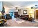Comfortable living room features dark brown leather furniture and a decorative fireplace at 4101 N Forbes Rd, Plant City, FL 33565
