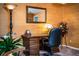 The home office has a wooden desk, vintage decor, and textured wallpaper at 4101 N Forbes Rd, Plant City, FL 33565