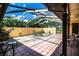 Expansive screened patio with comfortable seating and lush greenery, perfect for outdoor relaxation at 4101 N Forbes Rd, Plant City, FL 33565